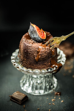 Yummy food photography of melted chocolate pudding with fig